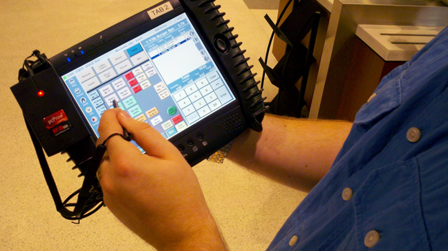 Figure 10-2. Pen tablets are reasonably common in industry, for sales and checkout (as shown here), and for various types of data gathering or interchange. The interaction methods allow the user to remain standing, or to use the device in situations where a laptop would take too much effort or attention. Touch is already making some headway into these markets, and gesture interfaces may be even more suitable for some fields that are dirty and/or dangerous.